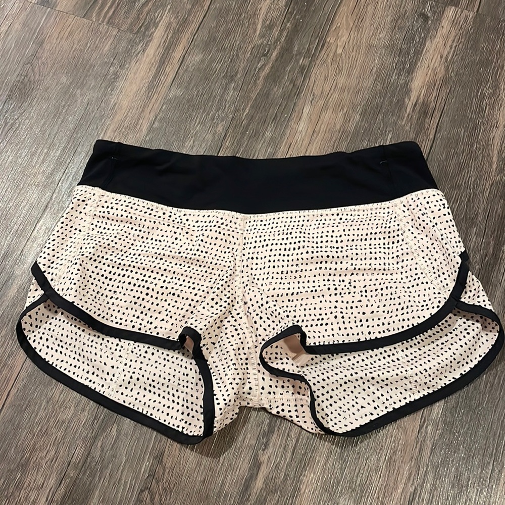 Size 4 Rare Lululemon speed up Pale pink and black speed up shorts.
